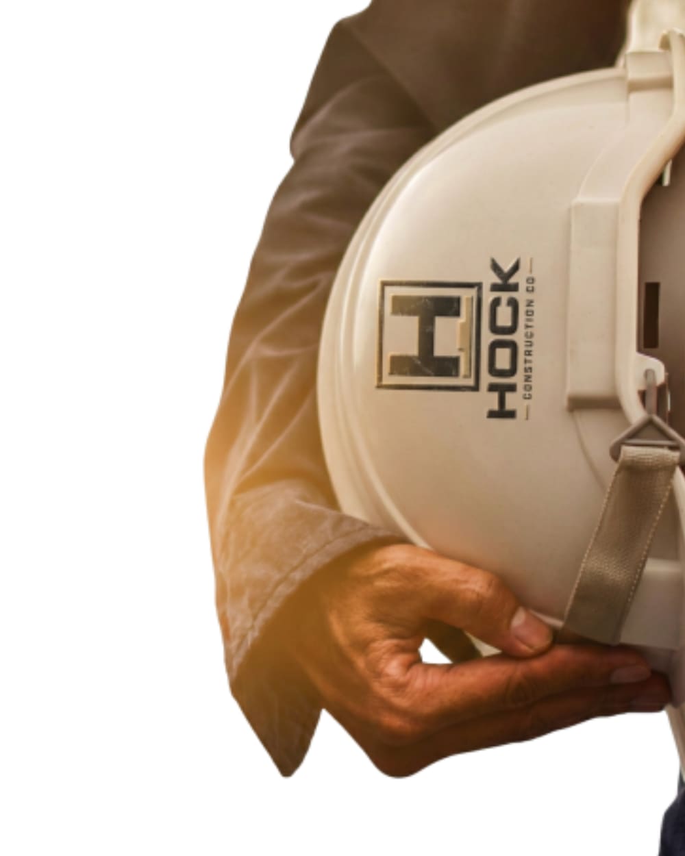 Hock Construction Co. hard hat carried by a team member on a jobsite