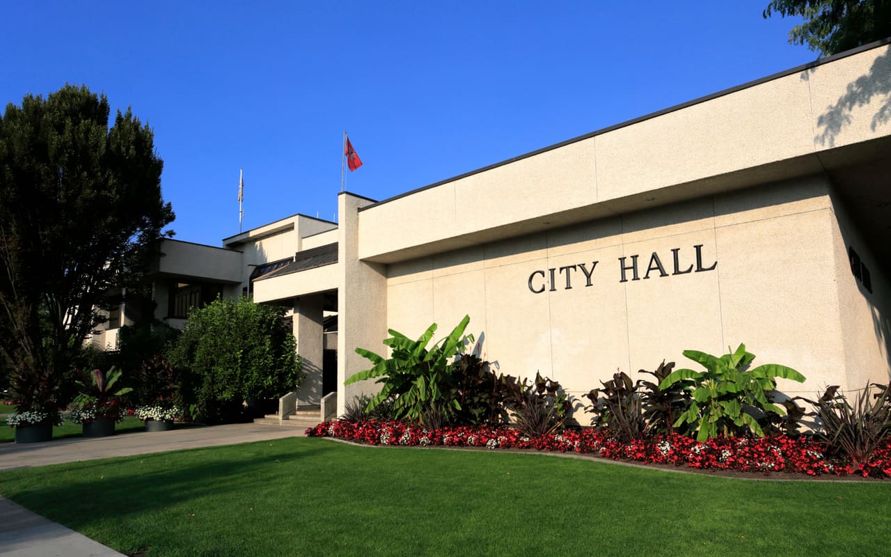 Government building with landscaped entrance representing public-sector construction